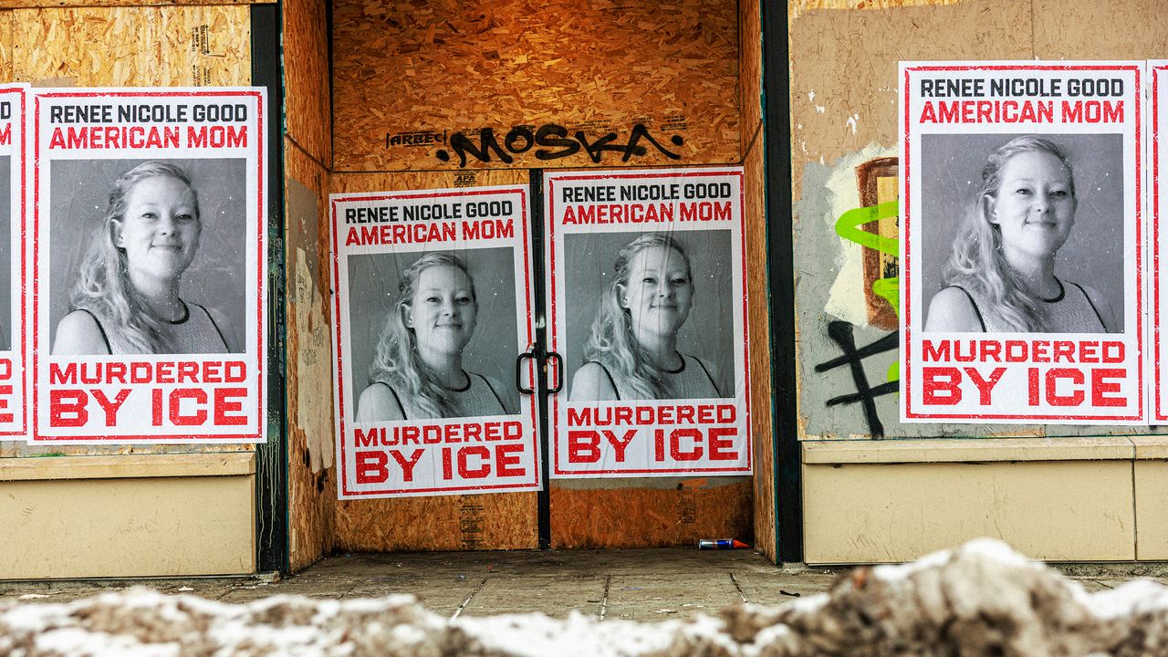 Businesses boarded up in parts of Minneapolis display posters of Renee Nicole Good on plywoodcovered windows following...